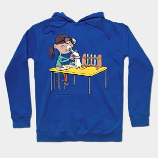 girl with a microscope is doing an experiment and writing down the details Hoodie